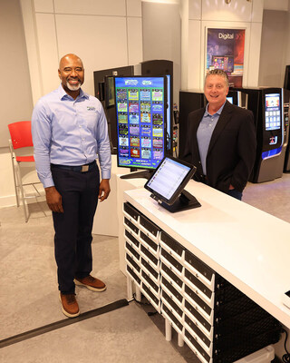 Antonio Robertson, Corporate Account Sales Manager for the South Carolina Education Lottery (left) previews Scientific Games’ SCiQ® retail technology with Michael Martin, VP, Retail Solutions at the company’s global headquarters in metro Atlanta. The system will soon roll out at SCEL retailers to make lottery products easier to manage and sell to South Carolina players. Antonio Robertson, Corporate Account Sales Manager for the South Carolina Education Lottery (left) previews Scientific Games’ SCiQ® retail technology with Michael Martin, VP, Retail Solutions at the company’s global headquarters in metro Atlanta. The system will soon roll out at SCEL retailers to make lottery products easier to manage and sell to South Carolina players.
