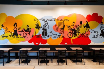 A colorful mural above the seating inside Stitch Coffee in Canton, Georgia.