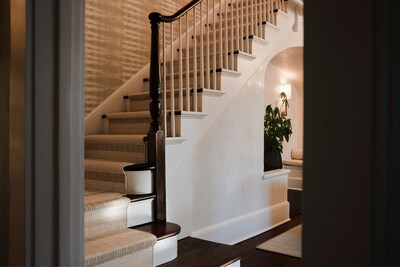 Ernesta's made-to-order stair runners make it easier than ever to elevate this transitional space, tying it effortlessly into the home's overall design.