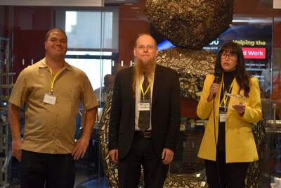 Centers Health Care's Jose DeLarosa and Yonah Levant receive recognition from AHRC NYC's Edie Weber.