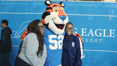 Teachers pose with Tony the Tiger