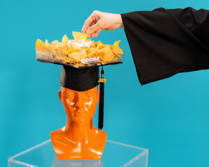 QDOBA Celebrates Class of 2025 with Chips and Queso Graduation Cap and Free Year of QDOBA for Lucky Grads
