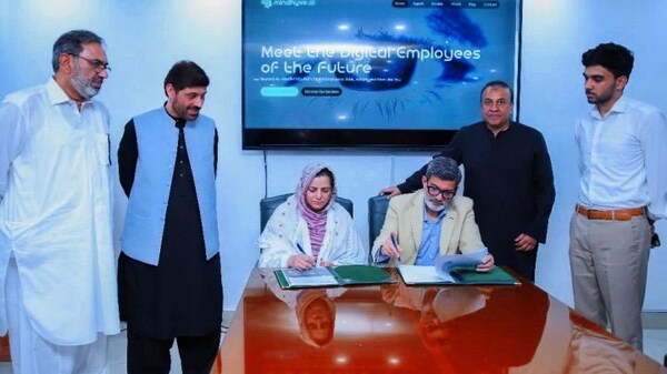 Dr. Saima Hassan, representing SmartLearnify, and Belal Faruki, Founder and CEO of Mindhyve.ai™, sign an  MoU to collaborate on advancing AI-driven digital learning solutions