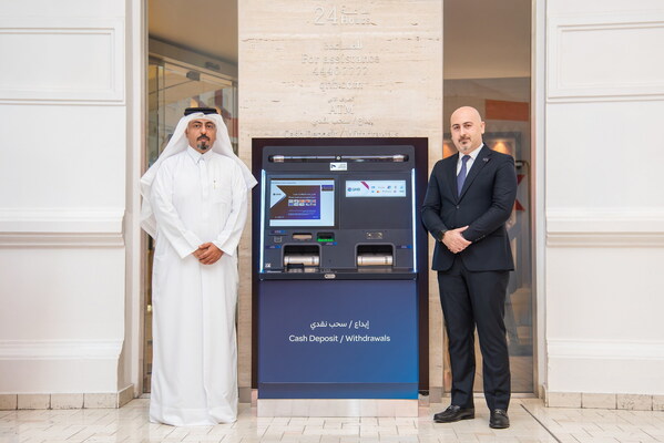 From left to right: Adel Al-Malki, Senior Executive Vice President – Group Retail Banking at QNB Group and Hicham Yamout, Area Manager – Diebold Nixdorf, posing with the DN Series® 500 cash recycler. From left to right: Adel Al-Malki, Senior Executive Vice President – Group Retail Banking at QNB Group and Hicham Yamout, Area Manager – Diebold Nixdorf, posing with the DN Series® 500 cash recycler.