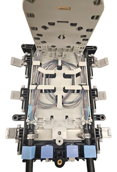 The slack storage area of PLP's COYOTE® STP-XL Closure shown with Lightera's 144-count AccuRoll® DC Rollable Ribbon Cable.