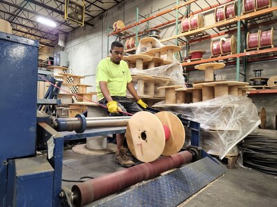 Wesco employee cutting wire in a Kansas facility.