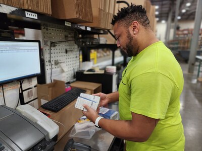 Wesco employee packing a shipment for a customer in a Pennsylvania facility.