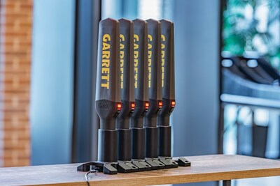 Five Garrett Guides charging in sequence while mounted on charging bases. Five Garrett Guides charging in sequence while mounted on charging bases.