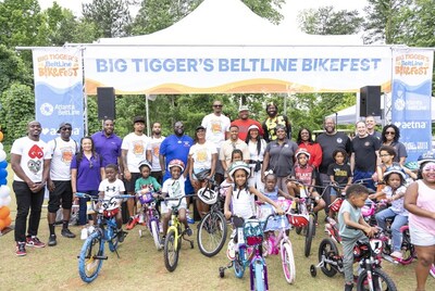Big Tigger, Beltline CEO, Clyde Higgs and 2024 BikeFest participants with their bikes