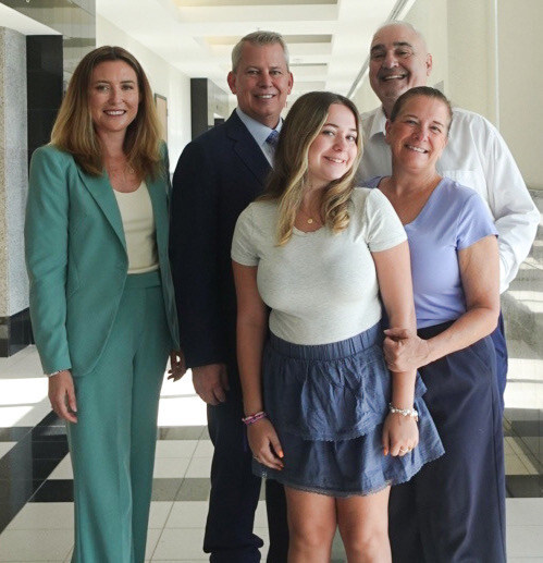 The D’Andrea family and their RDCY attorneys in the courthouse. The D’Andrea family and their RDCY attorneys in the courthouse.