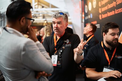 EMEA Territory Director, Jeff Jones, discussing Admin By Request Zero Trust Platform with an attendee at the V2 Security Conference in Copenhagen, May 2025