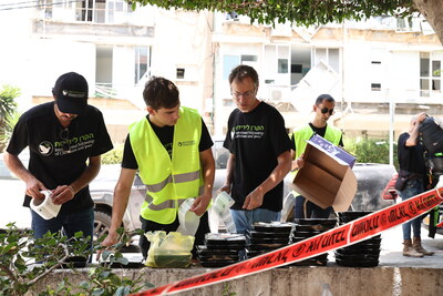 Fellowship staff members prepare to deliver meals to elderly residents of Bat Yam, Israel, on June 16, 2025, following the Iranian missile attacks that fell on and heavily damaged the city the night before.  Photo Credit: IFCJ/Mishel Amzaleg