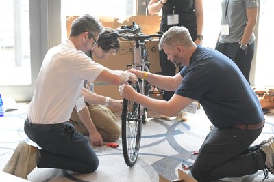Assembling the bikes at the MD Energy Charity Bike Build event.