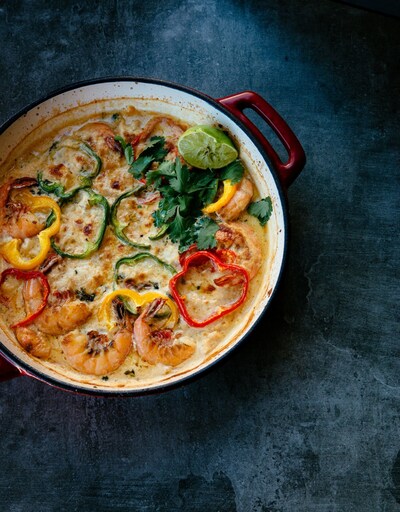 The Moqueca de Camarão feature is a rich shrimp seafood stew, brimming with bold ingredients and vibrant spices—every spoonful is a flavorful indulgence worth savoring.