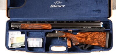 Blaser 12 gauge F3 over/under shotgun, Serial #FR015626, with sporting sideplate receiver, 30in raised-vent rib barrel, 3in chambers, single selective trigger with ejectors. French grey receiver profusely engraved by Bonsi Brothers in their Heritage (vine & scroll) pattern. Factory-cased with five extended choke tubes, wrench, takedown tools and barrel weights. Mechanically excellent; exceptionally fine condition. Estimate: $6,000-$9,500