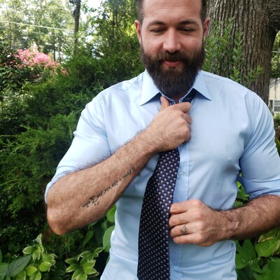Prescient AI Co-founder and CTO, Cody Greco, shows his love for math with a tattoo of the Bellman equation.