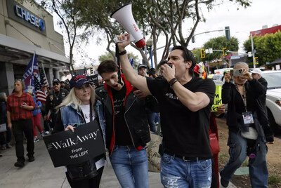 Straka leads #WalkAway march crowd through West Hollywood in April, 2025.