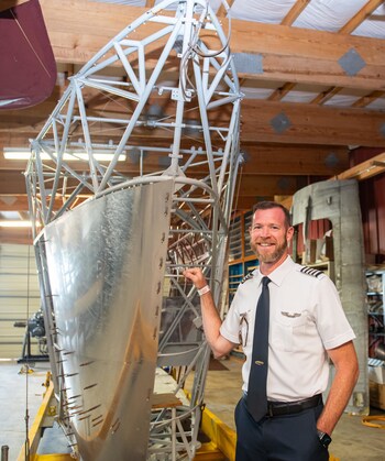 Goodyear's Chief Pilot Michael Dougherty stands next to the gondola frame.