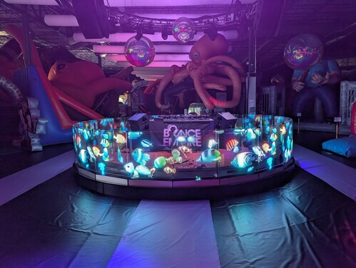 The exotic adventures, mind-blowing décor, and spectacular fun at Bounce Empire just outside Denver, Colo., jumped to even higher heights with a new Digital Signage Solution (DSS) from JCM Global® (JCM). JCM installed a circular CLEAR display at Bounce Empire, the world’s largest indoor inflatable amusement park. The exotic adventures, mind-blowing décor, and spectacular fun at Bounce Empire just outside Denver, Colo., jumped to even higher heights with a new Digital Signage Solution (DSS) from JCM Global® (JCM). JCM installed a circular CLEAR display at Bounce Empire, the world’s largest indoor inflatable amusement park.