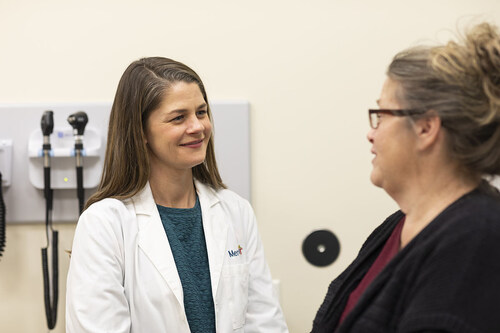 Dr. Molly Ehlman, left, a Mercy geriatrician, said DAX “makes it possible to focus on the person in front of me instead of the computer screen. I can look patients in the eyes and really hear what they’re saying without worrying about typing notes during their visit. It allows me to spend less time in front of a computer and more time on the aspects of patient care that matter most.