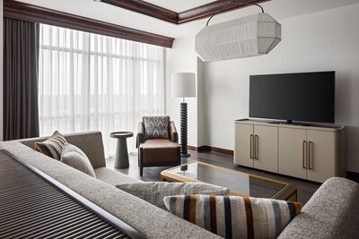 The updated executive suite offers a stylish and spacious living area with modern accents—perfect for relaxing or hosting guests in comfort.