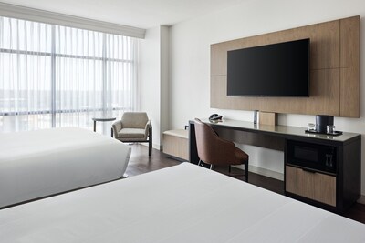 A redesigned double queen guest room featuring modern workspaces and city views—blending function and comfort for today’s business and leisure travelers.