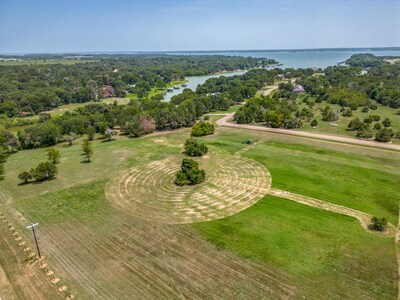 Offers being accepted: 61583 La Bota in Corsicana, Texas, a 6-acre, subdividable lot with mature trees and convenient access to Richland-Chambers Lake. Whether realized as a weekend retreat or a year-round residence, this scenic property is the perfect blank canvas in Arrowhead, one of the premier communities on the lake. Offers being accepted: 61583 La Bota in Corsicana, Texas, a 6-acre, subdividable lot with mature trees and convenient access to Richland-Chambers Lake. Whether realized as a weekend retreat or a year-round residence, this scenic property is the perfect blank canvas in Arrowhead, one of the premier communities on the lake.