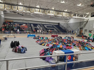 The backpack, shoe, and resource distribution area at the Back-to-BOLD event, preparing to welcome families with essential supplies for the new school year.