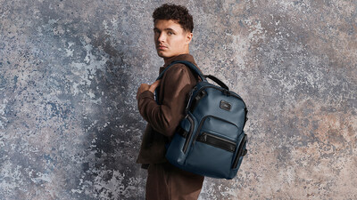 Lando Norris pictured with the Alpha Bravo Navigation Backpack in Navy Coated Canvas. Lando Norris pictured with the Alpha Bravo Navigation Backpack in Navy Coated Canvas.