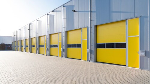 A series of modern warehouses representing streamlined multi-site facility operations
