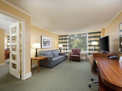 A well-appointed suite at DoubleTree by Hilton Stamford, complete with separate living space for added comfort during extended stays.
