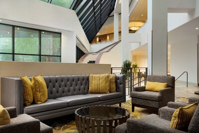 The contemporary lobby at DoubleTree by Hilton Stamford features inviting lounge space and stylish design for relaxing or connecting.