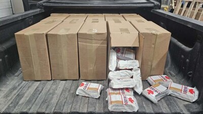 A large quantity of unstamped cigarettes were discovered concealed inside cardboard boxes during a vehicle inspection. (CNW Group/Royal Canadian Mounted Police - Central Region)