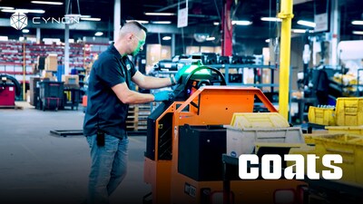 A coats employee sends Cyngn's autonomous DriveMod Tugger to its next station. The on-vehicle display is one of several ways to control the vehicle. A coats employee sends Cyngn's autonomous DriveMod Tugger to its next station. The on-vehicle display is one of several ways to control the vehicle.