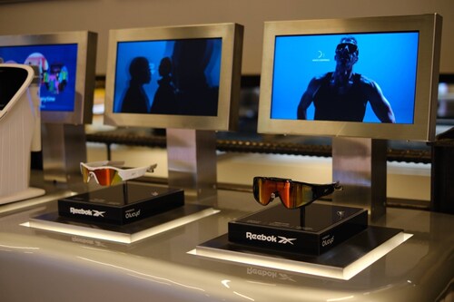 Reebok Powered by Lucyd frames on sale at the TM:RW store in Times Square. The screens play continuous Reebok X Lucyd marketing content. Image courtesy Innovative Eyewear, Inc. Reebok Powered by Lucyd frames on sale at the TM:RW store in Times Square. The screens play continuous Reebok X Lucyd marketing content. Image courtesy Innovative Eyewear, Inc.