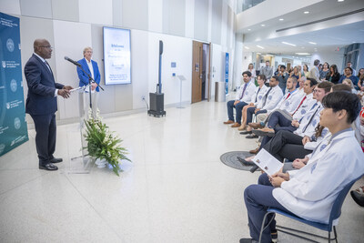 Clyde White, President and CEO of Peach State Health Plan, and David Hess, MD, Dean of the Medical College of Georgia, address students.