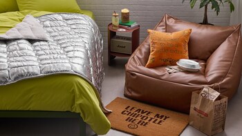 Highlights of the Urban Outfitters x Chipotle "A Little Extra" collection include bean bag chairs inspired by black and pinto beans, a cozy throw blanket designed to look like a foil-wrapped tortilla and a desk light shaped like Chipotle’s iconic chip bag. Highlights of the Urban Outfitters x Chipotle "A Little Extra" collection include bean bag chairs inspired by black and pinto beans, a cozy throw blanket designed to look like a foil-wrapped tortilla and a desk light shaped like Chipotle’s iconic chip bag.