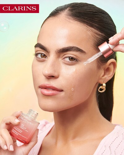 Sarah Jane Nader with Clarins Multi Active Serum