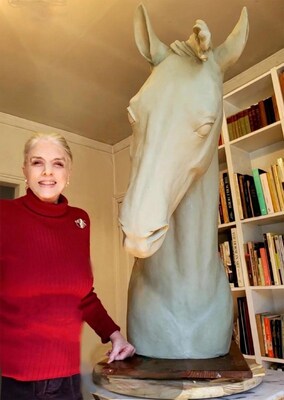 Image of Rosamonde Pinchot with a horse sculpture.