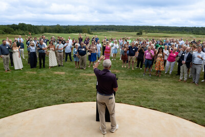 Cutalong at Tributer Resort members toast the occasion during speeches at the Golf Clubhouse grand opening