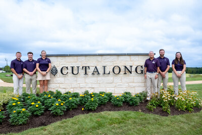 Cutalong at Tributer Resort employees mark the debut of the newly opened Golf Clubhouse