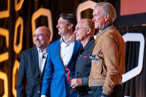 :                        PostNet Senior Regional Director Gene Cummings, PostNet President and COO Ryan Farris, left to right, and Fortidia CEO Paolo Fiorelli, far right, present PostNet of Round Rock owner Greg Claiborne with the Franchisee of the Year award at the company's annual conference in Chicago. :                        PostNet Senior Regional Director Gene Cummings, PostNet President and COO Ryan Farris, left to right, and Fortidia CEO Paolo Fiorelli, far right, present PostNet of Round Rock owner Greg Claiborne with the Franchisee of the Year award at the company's annual conference in Chicago.