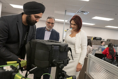 Brar's Owner, Dial Pabla and CEO Kiran Mann, learning about Trexo Robotic Legs, with Trexo CEO and Co-founder Manmeet Maggu, (CNW Group/Trexo Robotics)