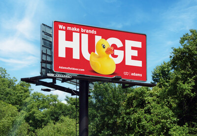 Adams Outdoor Advertising poster billboard featuring the "We Make Brands Huge" campaign with a giant yellow rubber duck reveal.