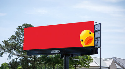 Adams Outdoor Advertising digital billboard showing the teaser campaign with a bright yellow rubber duck peeking playfully, part of a creative out-of-home advertising display.