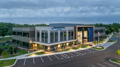 The 815 Building illuminated at dusk highlights the modern architectural design that consolidates Heaven Hill Brands' Louisville teams under one roof for the first time in years, housing approximately 150+ employees.
