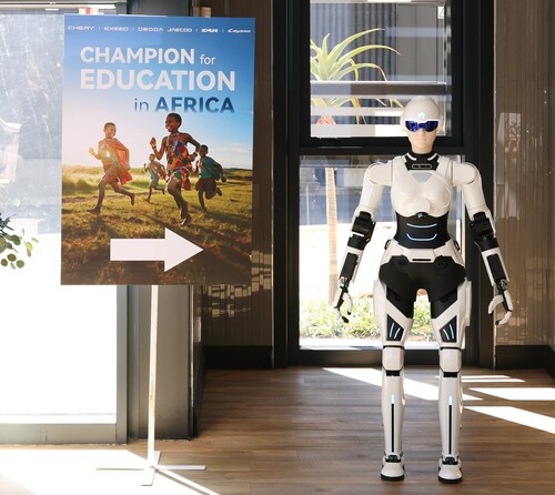 Mornine serves as event greeter at the “Champion for Education in Africa” venue. Mornine serves as event greeter at the “Champion for Education in Africa” venue.