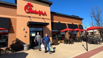 A community partner departs a Chicago-area Chick-fil-A restaurant with surplus items to transport back to the local organization.