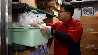 Chick-fil-A Team Member in the Miami area prepares surplus food to be donated to a local community partner.