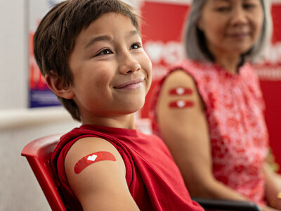 Flu vaccinations available at CVS Pharmacy. (Photo of boy and woman post vaccination.)